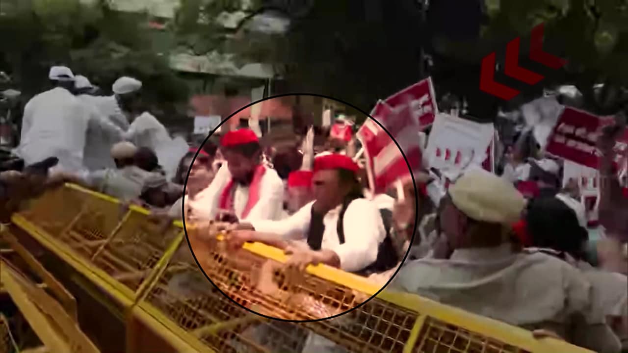 Akhilesh Yadav Jumps Police Barricade During Opposition Protest